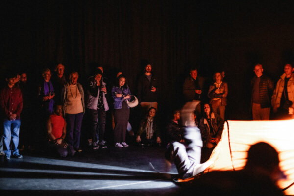 Heidi Duckler Dance NW 2026 Come As You Are Festival presented by Heidi Duckler Dance NW. Dancers Charles Roy and Daniel Girón with composer/percussionist Machado Mijiga, performing a prologue to a new site specific work inspired by John Steinbeck’s Grapes of Wrath. March 14, 2026. Photo by Jason Quigley.