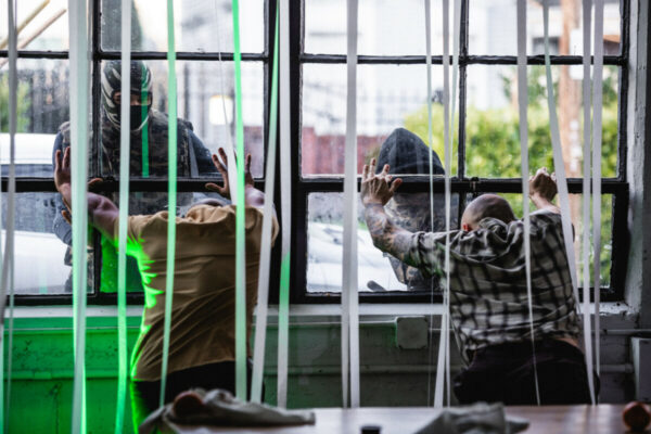 Heidi Duckler Dance NW 2026 Come As You Are Festival presented by Heidi Duckler Dance NW. Dancers Charles Roy and Daniel Girón with composer/percussionist Machado Mijiga, performing a prologue to a new site specific work inspired by John Steinbeck’s Grapes of Wrath. March 14, 2026. Photo by Jason Quigley.
