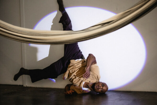 Heidi Duckler Dance NW 2026 Come As You Are Festival presented by Heidi Duckler Dance NW. Dancers Charles Roy and Daniel Girón with composer/percussionist Machado Mijiga, performing a prologue to a new site specific work inspired by John Steinbeck’s Grapes of Wrath. March 14, 2026. Photo by Jason Quigley.